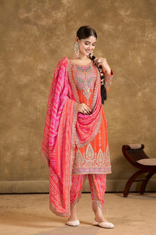 Radiant Glow: Orange Punjabi Suits with Pink & White Accents