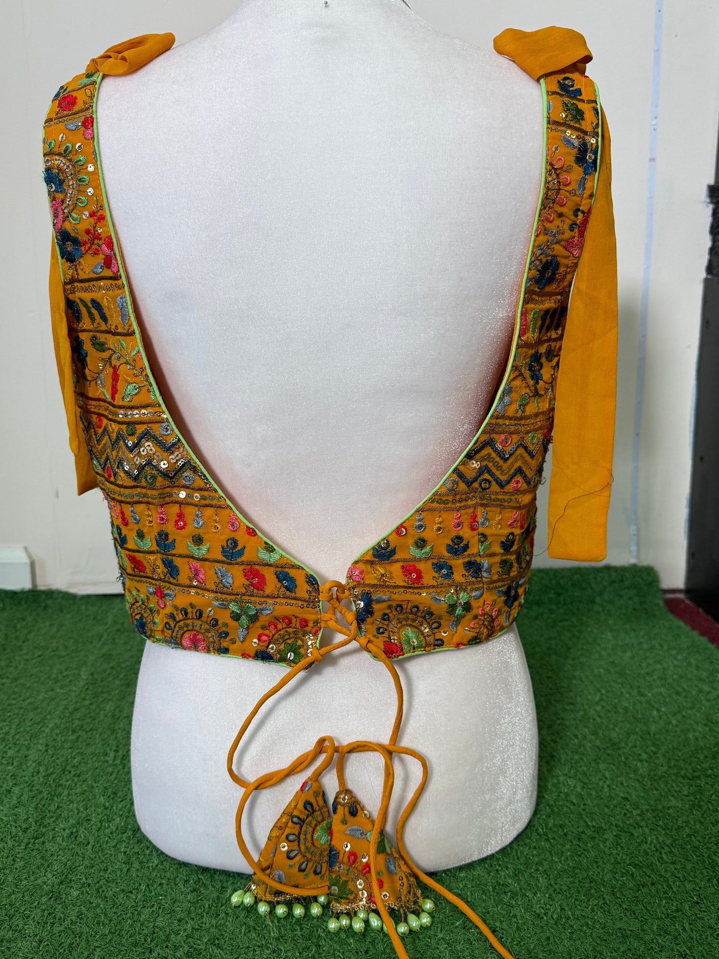 Mustard Yellow Rajasthani Georgette Sleeveless Blouse with Colorful Embroidery