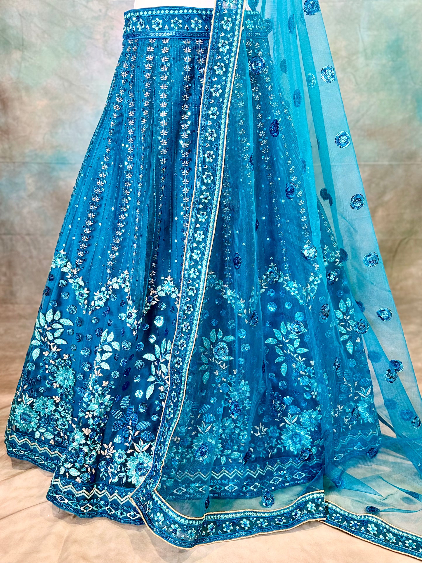 Blue pure georgette lehenga with amadory sequins and embroidery.