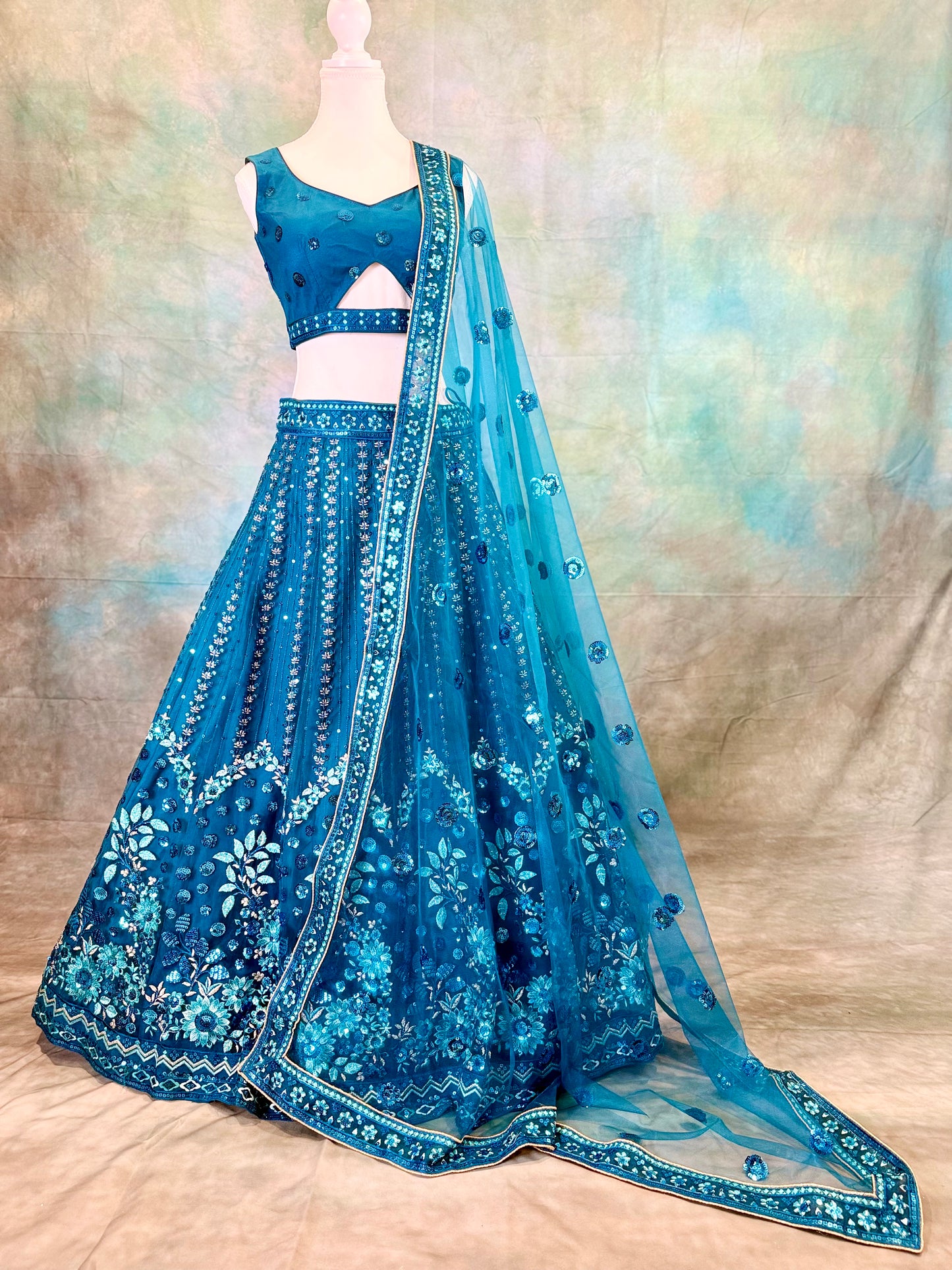 Blue pure georgette lehenga with amadory sequins and embroidery.