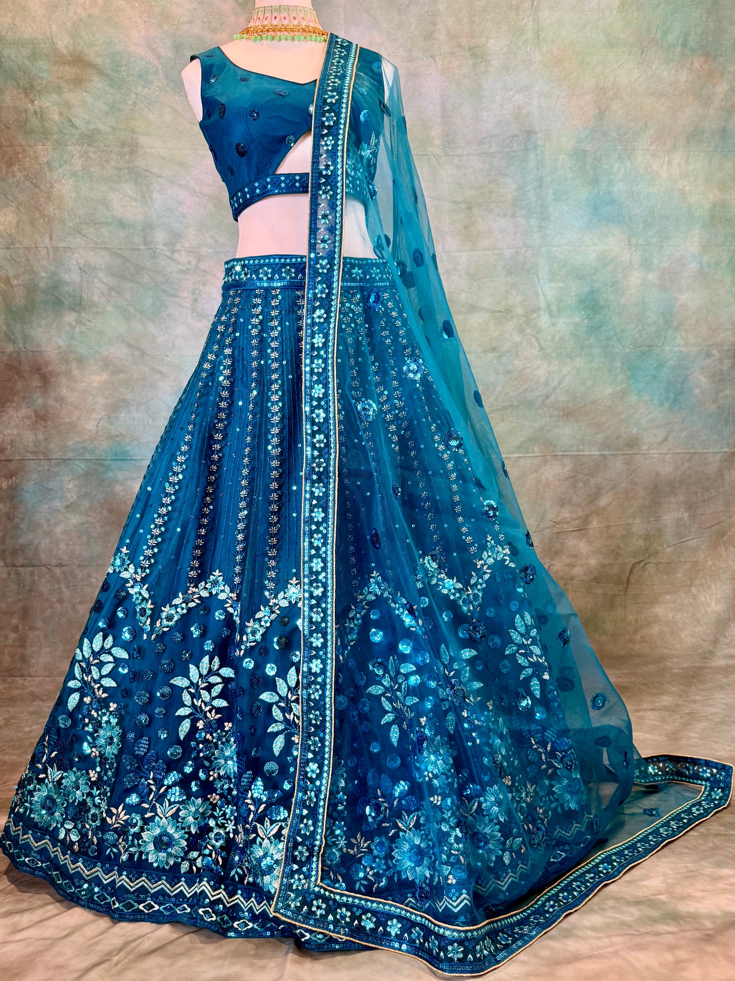 Blue pure georgette lehenga with amadory sequins and embroidery.