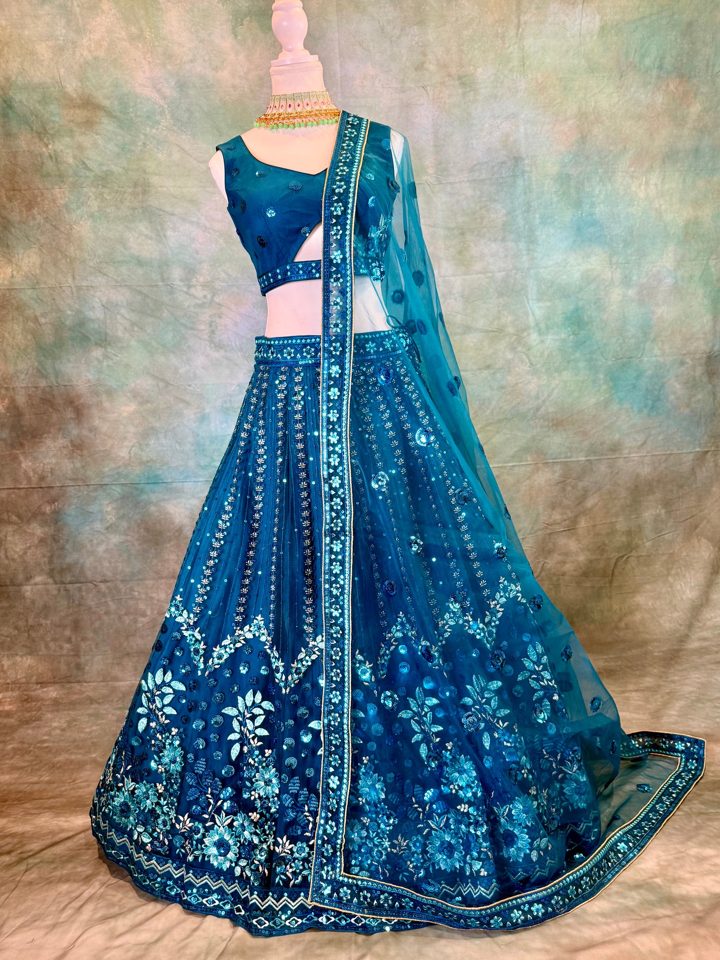 Blue pure georgette lehenga with amadory sequins and embroidery.