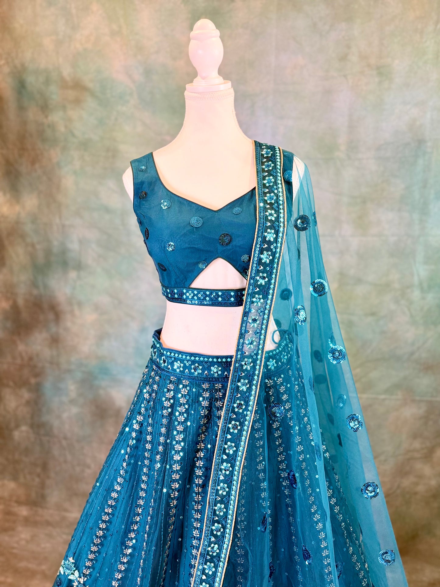 Blue pure georgette lehenga with amadory sequins and embroidery.